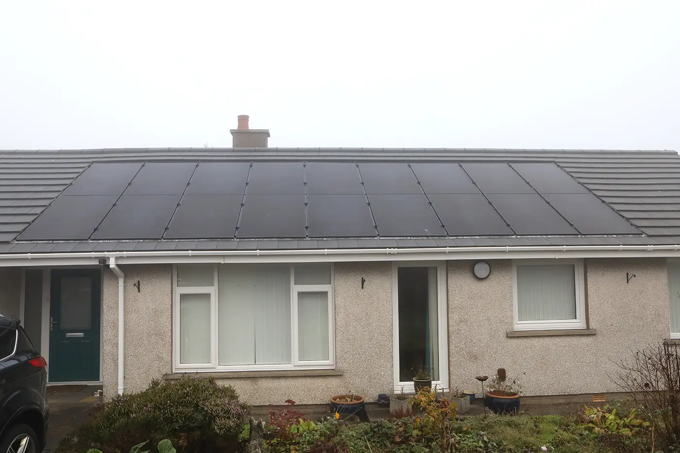Integrated solar pv panels shown on a terraced bungalow property.