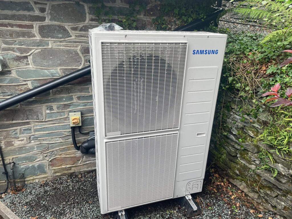 A white Samsung Air Source Heat Pump installation